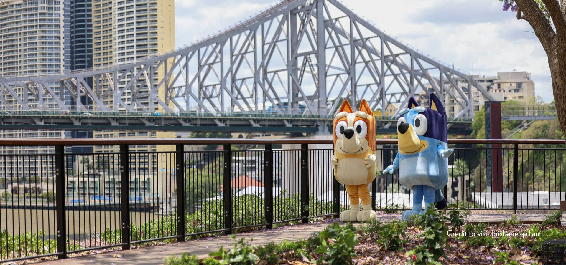 Credit to visit.brisbane.qld.au - Bluey & Bingo in front of the Story Bridge